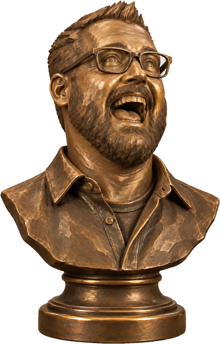 Bronze bust of Jason Moore, laughing, in glasses